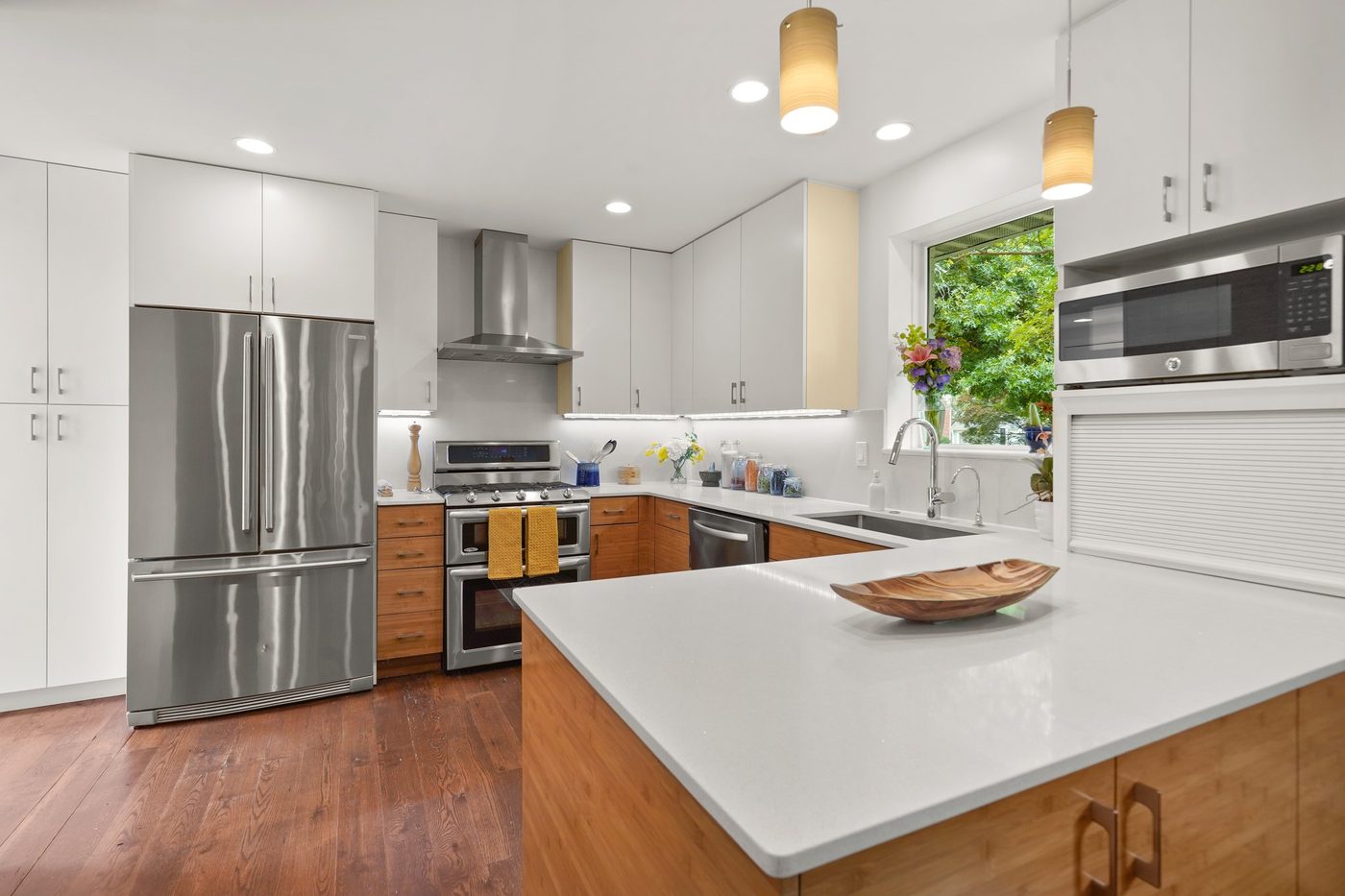 Bright kitchen with white cabinets and quartz island